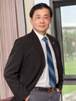 A person in a suit and tie

Description automatically generated with medium confidence